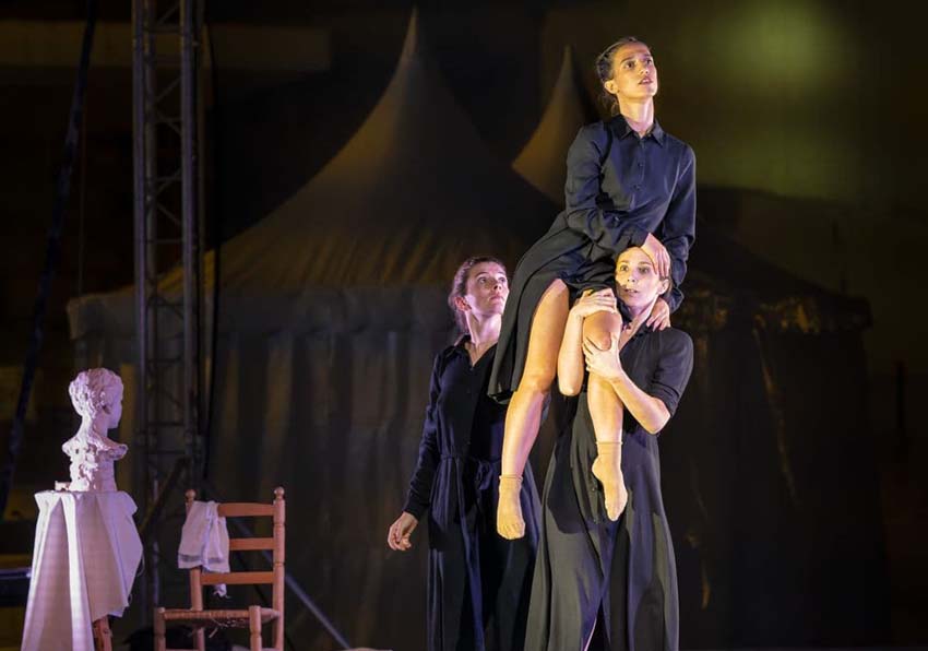 event image:Two women carrying another on their shoulders
